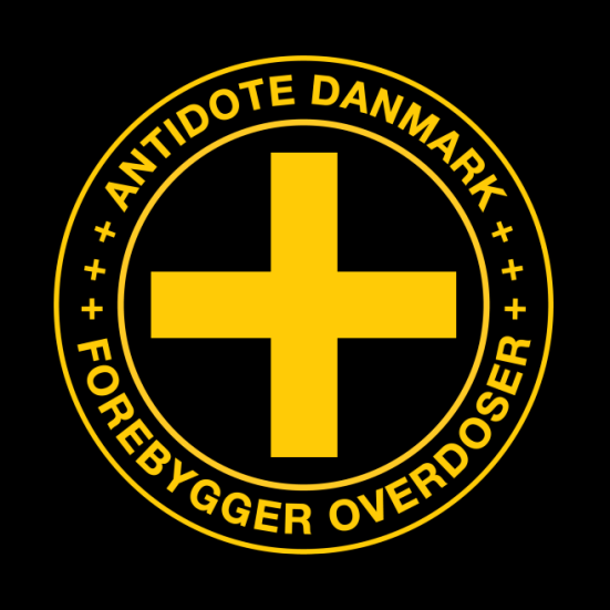 Antidote Danmarks logo - et gult kryds med to cirkler omkring